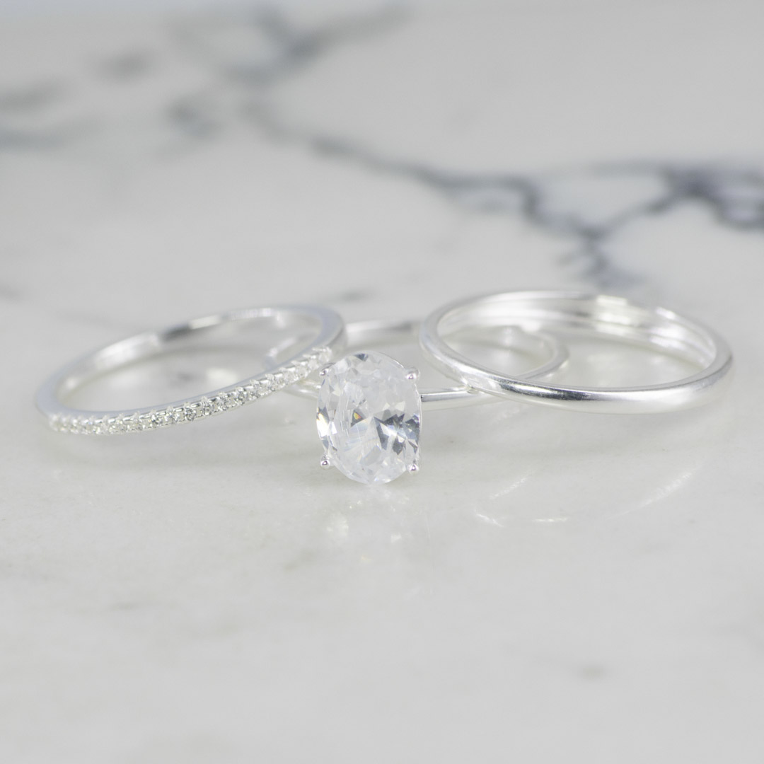 TRIO DE ANILOS SOLITARIO OVALO , LISO Y BANDA CIRCONES